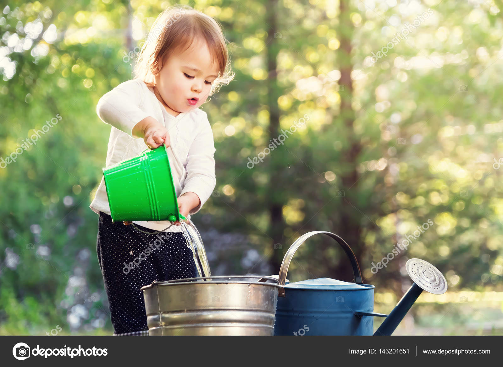 Girl playing with buckets — Stock Photo © Melpomene 143201651