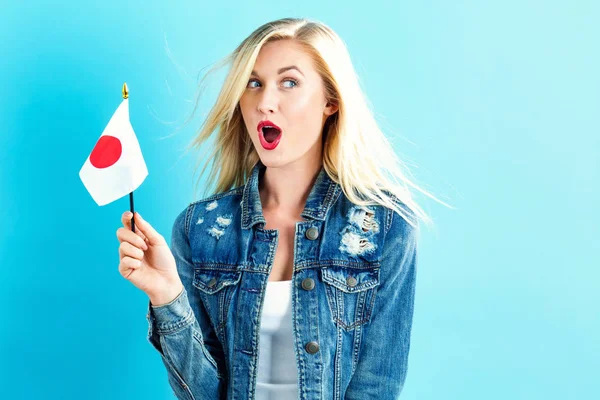 Женщина с японским флагом — стоковое фото