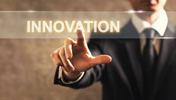 Innovation text med affärsman — Stockfoto