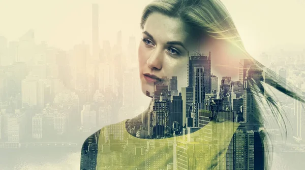 Double exposure of young woman and skyscrapers — Stock Photo, Image