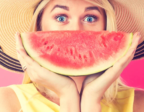 Happy young woman holding watermelon — Stock Photo, Image