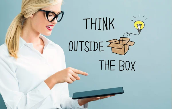 Think Out The Box text with business woman — стоковое фото