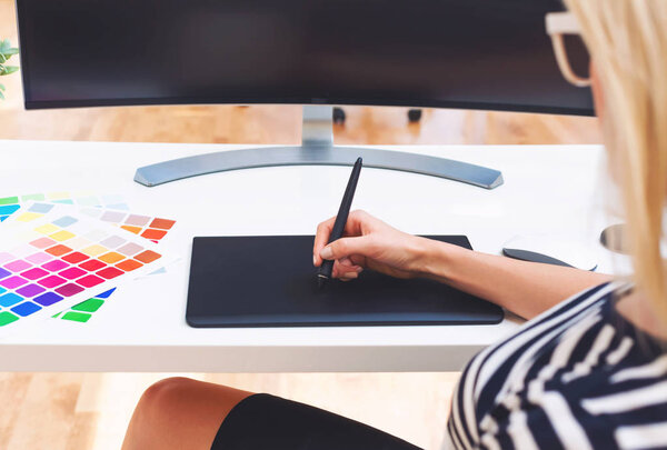 Graphic designer using her graphic tablet