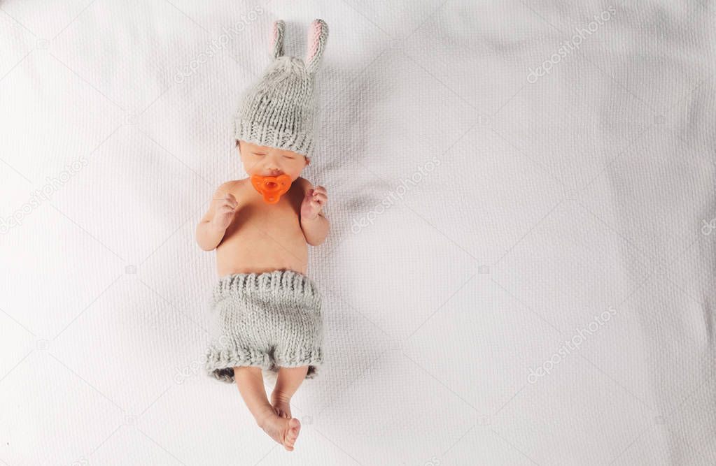 Newborn infant baby boy on a blanket