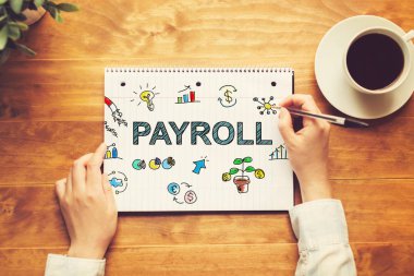 Bordro metin bir kalem tutan bir kişi ile