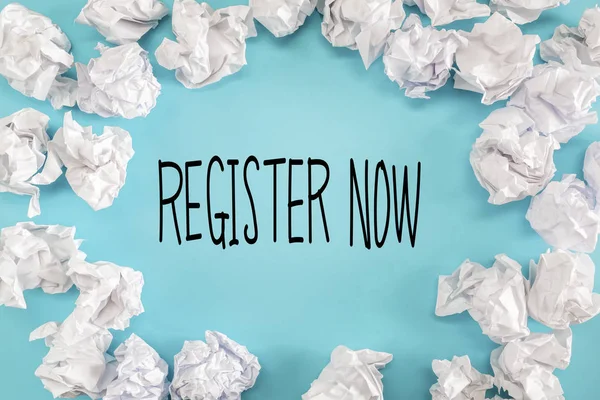 Register Now text with crumpled paper balls