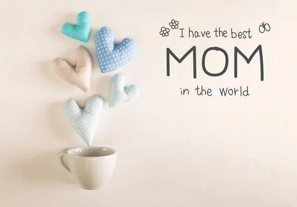 Muttertagsbotschaft mit blauen Herzkissen — Stockfoto