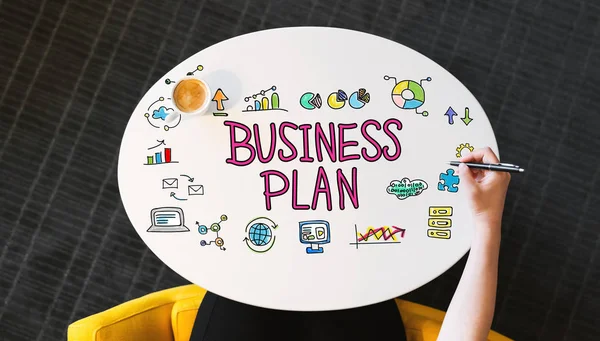 Texto do plano de negócios em uma tabela branca — Fotografia de Stock