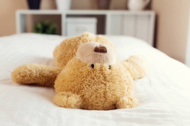 Teddy bear resting  clipart
