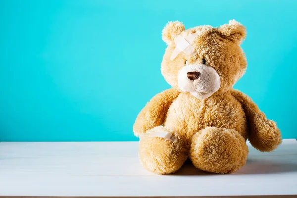 Teddy bear with a bandage — Stock Photo, Image