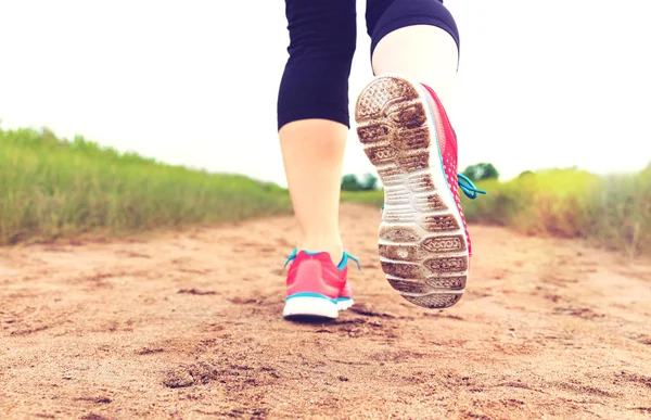 Female runner jogging outdoors — Stock Photo, Image