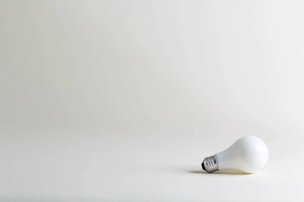 Colored lightbulb on a white — Stock Photo, Image