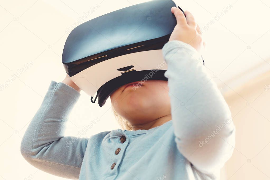 Toddler girl using a virtual reality headset