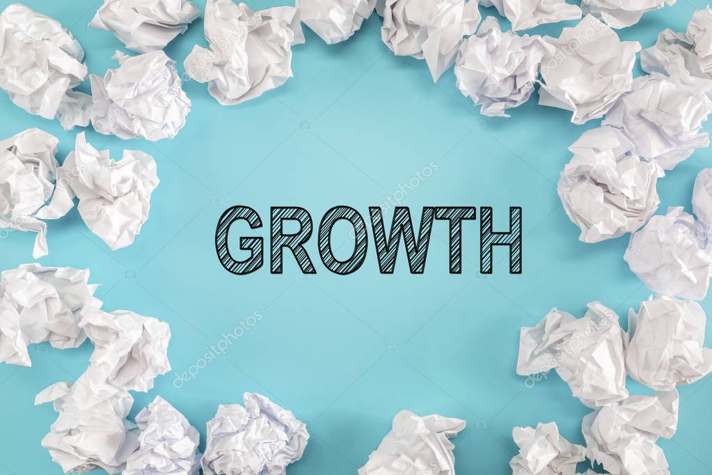 Growth text with crumpled paper balls