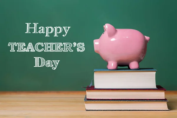 Happy Teachers Day message with pink piggy bank — Stock Photo, Image