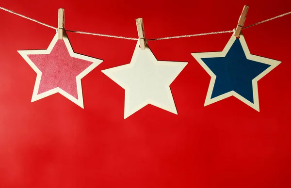 4th of July decorations on red background — Stock Photo, Image