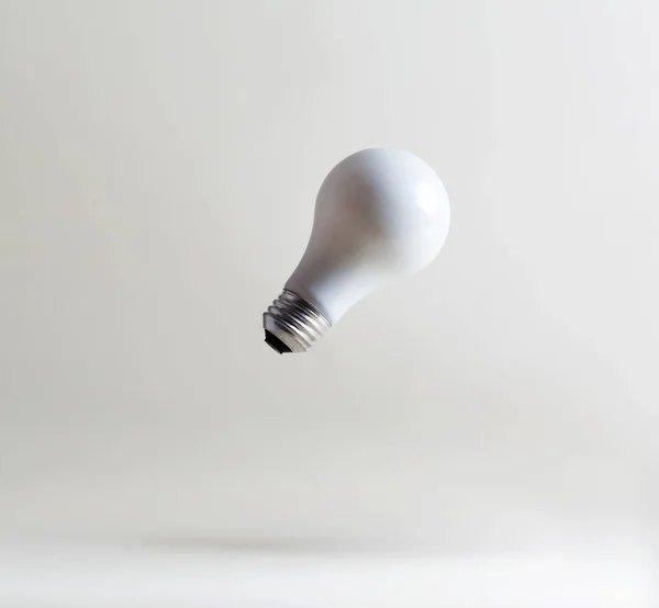 White light bulbs floating — Stock Photo, Image