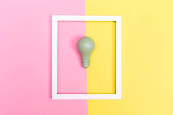Colored lightbulb on a duotone background — Stock Photo, Image