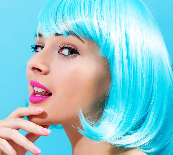 Beautiful woman in a bright blue wig