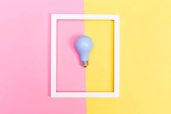 Stock image Colored lightbulb on a duotone background