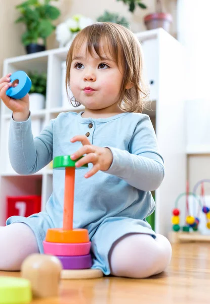 Toddler girl playing with toys — Stock Photo, Image