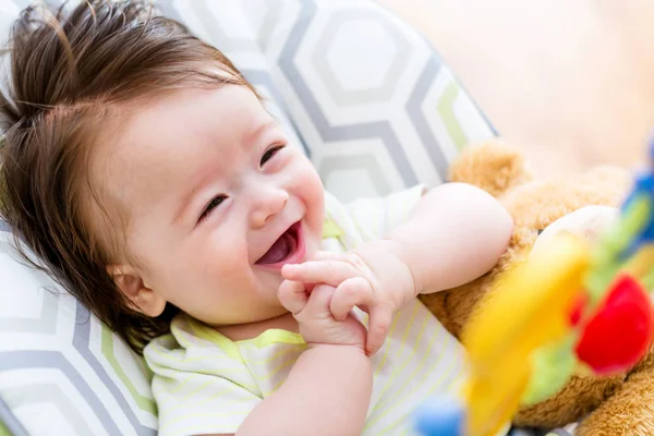 Baby boy playing with his toy