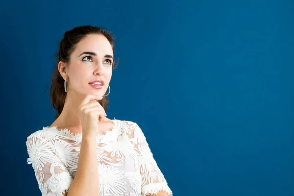 Young woman in a thoughtful pose — Stock Photo, Image