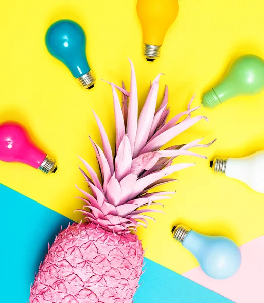 Painted pineapple with light bulbs — Stock Photo, Image