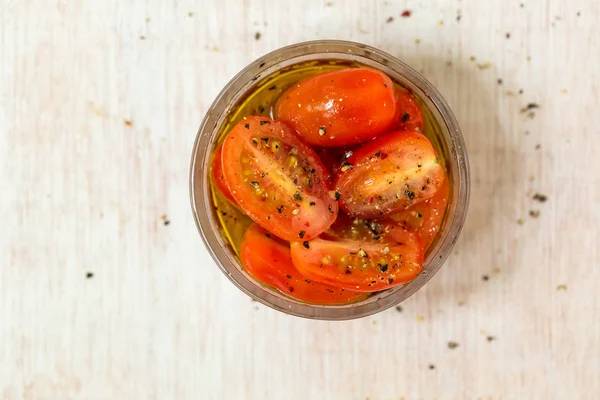 Sliced cherry tomatos in olive oil — Stock Photo, Image