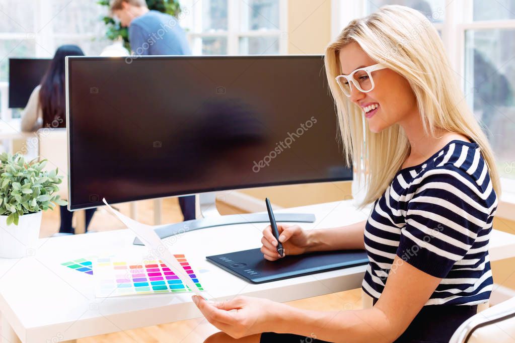 Graphic designer using her pen tablet device