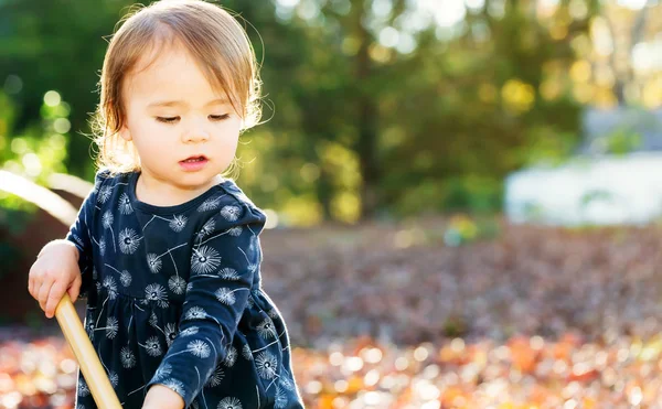 Toddler girl playing outside — Stock Photo, Image