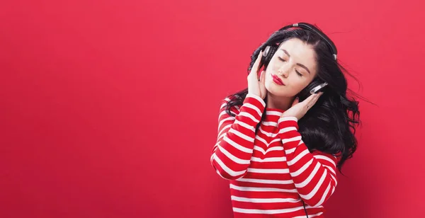 Happy young woman with headphones — Stock Photo, Image