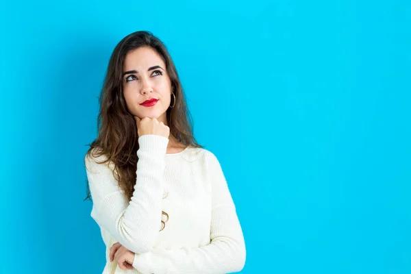 Young woman in a thoughtful pose — Stock Photo, Image