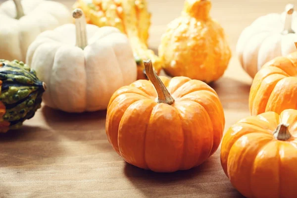 Pumpkins on a rustic wooden background — Stock Photo, Image