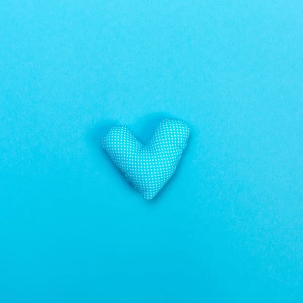 Handmade heart cushions on blue — Stock Photo, Image