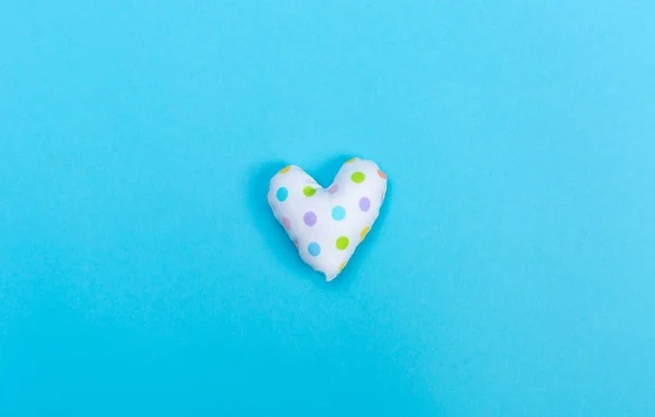 Handmade heart cushions on blue — Stock Photo, Image