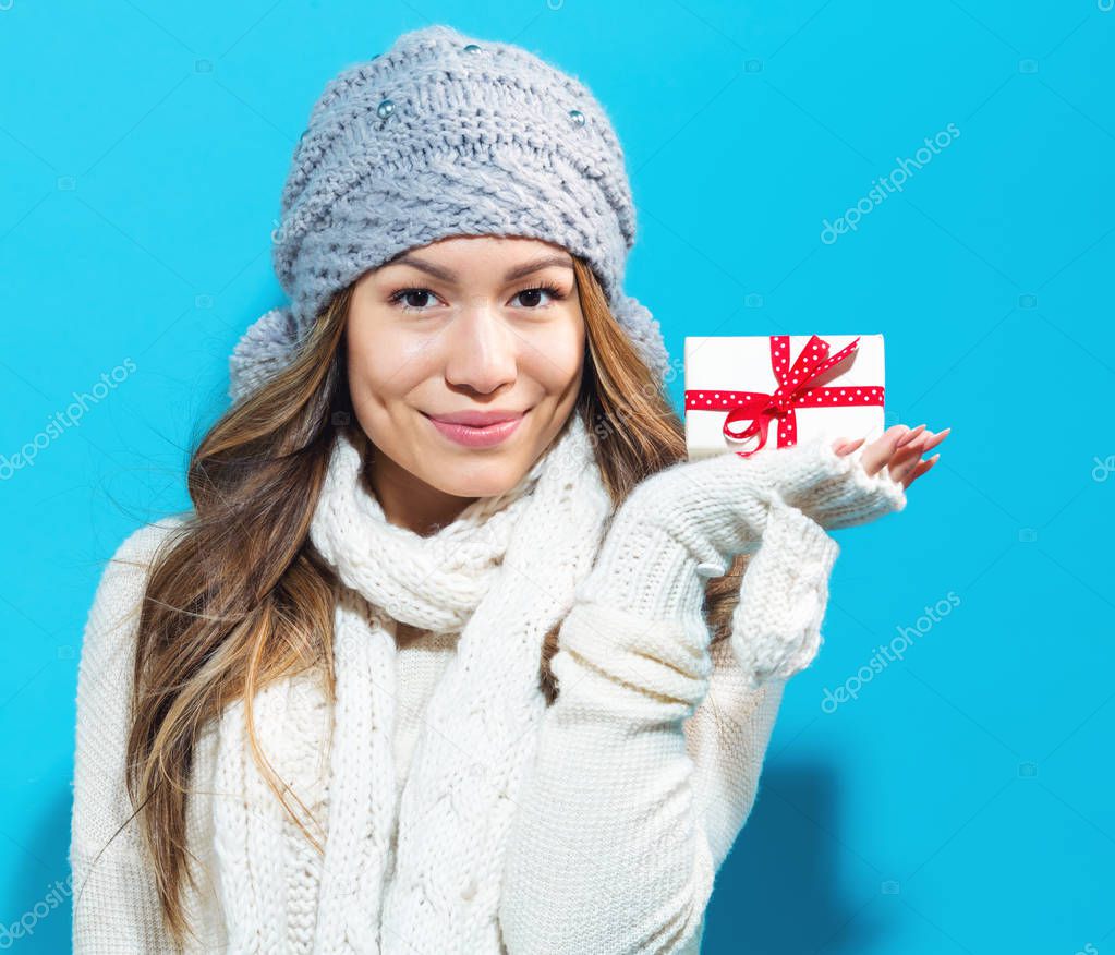 Young woman holding present