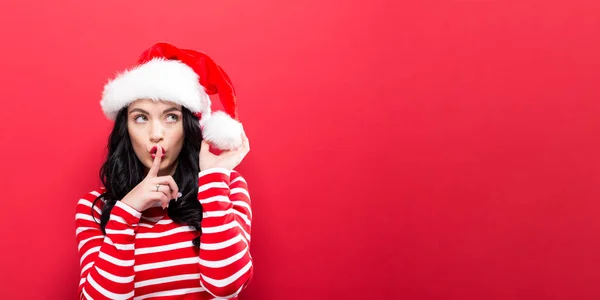 Donna con cappello Babbo Natale fare gesto tranquillo — Foto Stock