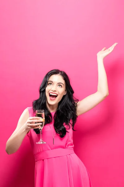 Jonge vrouw met een champagne fluit — Stockfoto