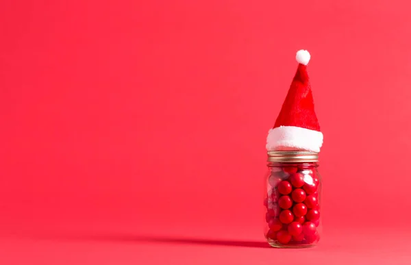 Santa čepice a candy džbán — Stock fotografie