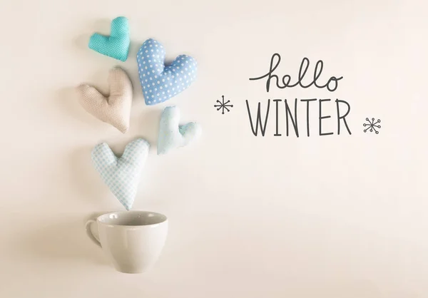 Olá mensagem de inverno com almofadas de coração azul — Fotografia de Stock