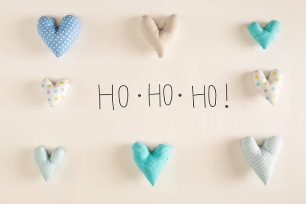 Mensagem Ho Ho Ho com almofadas de coração azul — Fotografia de Stock