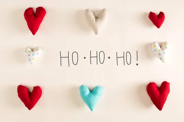 Mensagem Ho Ho Ho com almofadas de coração azul — Fotografia de Stock