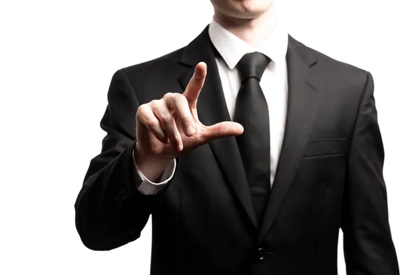 Homme d'affaires pointant son doigt sur un fond blanc — Photo