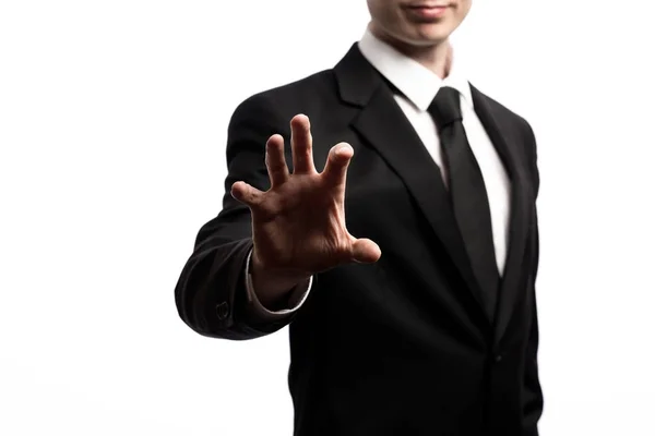 Homme d'affaires pointant ses doigts sur un fond blanc — Photo