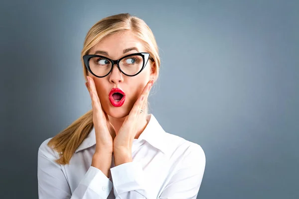 Surprised young woman posing