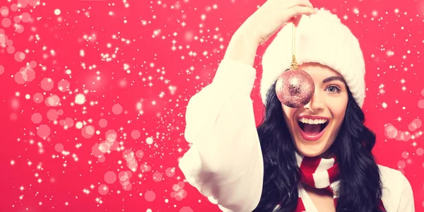 Woman holding Christmas bauble — Stock Photo, Image