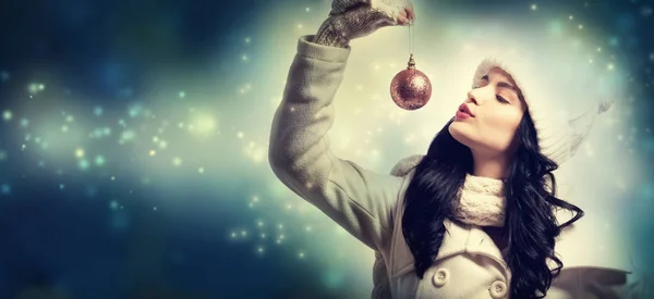 Woman holding Christmas bauble Stock Image