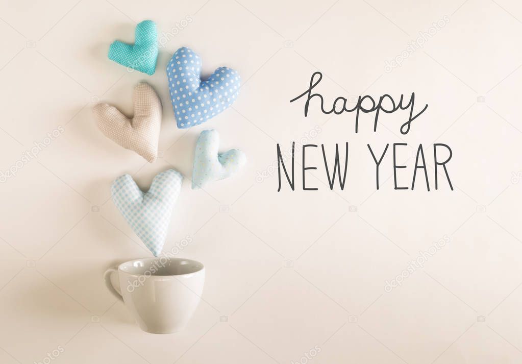 Happy New Year message with blue heart cushions