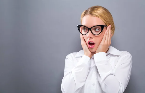 Surprised young woman posing — Stock Photo, Image